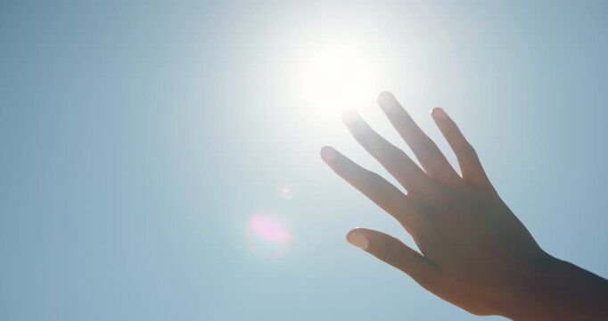 Blue sky, outdoor and hand of person with sunshine, block glare and shade eyes for protection from intense light. Vision support, uv rays and woman cover to prevent sunburn, mockup space and flare