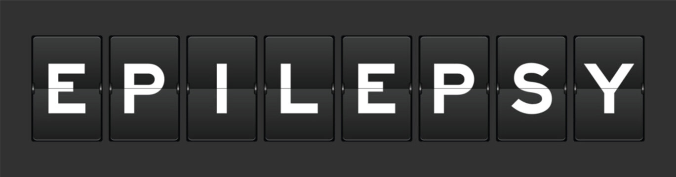 Black color analog flip board with word epilepsy on gray background