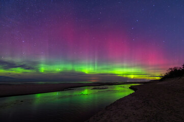 Aurora borealis northern lights over Baltic Sea in Latvia