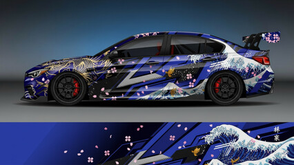 A blue sports car with a detailed Japanese-inspired cherry blossom and wave art wrap. © DB stock