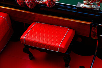 Naklejka premium Luxurious red leather seat in elegant gondola interior design