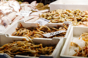 Fresh seafood market display with shrimp and fish on ice