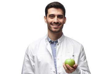 Portrait of smiling dentist holding green apple