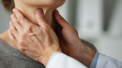 Doctor palpating a female patient's neck during a thyroid examination, illustrating medical care, diagnosis and health checkup in a clinical setting.