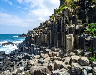 Coastal basalt columns under a blue sky