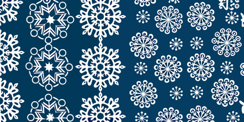 Intricate white snowflake patterns repeat on a deep navy blue background