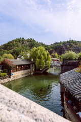 Fototapeta premium Traditional waterfront village and lake in Gubei Water Town China