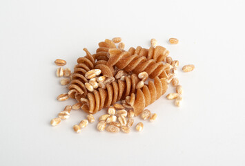 Obraz premium Raw Brown Pasta, Wholegrain Fusilli, Dry Whole Grain Noodle, Raw Spelt Macaroni, Healthy Italy Food