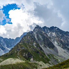 Mountainous landscape under partly cloudy sky