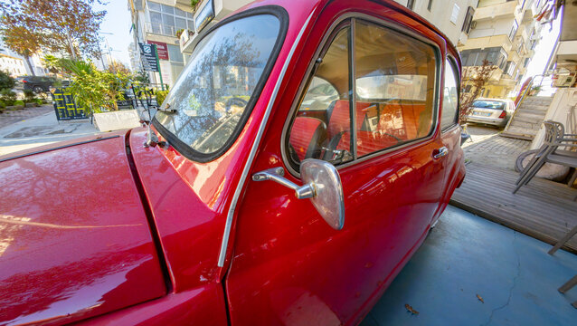 Vintage red Zastava 750, a classic Serbian-produced compact car, showcasing retro automotive design and historical character in Durres, Albania 11.12.2025 