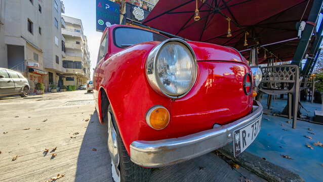 Vintage red Zastava 750, a classic Serbian-produced compact car, showcasing retro automotive design and historical character in Durres, Albania 11.12.2025 