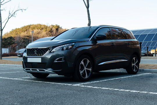 December 15, 2020, Seoul, South Korea - A Peugeot 5008 SUV parked in an outdoor lot with solar panels in the background.