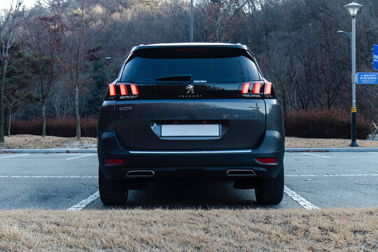 December 15, 2020, Seoul, South Korea - The rear view of a dark grey Peugeot 5008 SUV parked in an outdoor parking lot.