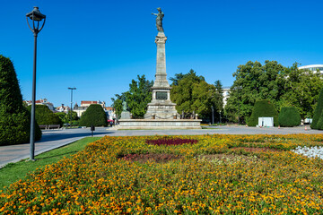 Monument of Liberty in Ruse with colorful flower garden