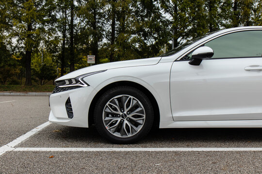 October 11, 2020, Seoul, South Korea - A white Kia K5 sedan parked in an outdoor parking lot.