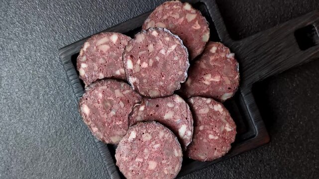 Black blood pudding, grilled pork sausage cooked for dinner. Blood pudding as a food background for your design