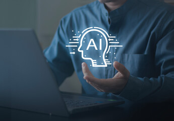  Business professional presenting artificial intelligence icon above laptop, symbolizing AI innovation, digital transformation, machine learning, smart technology and future business solutions.