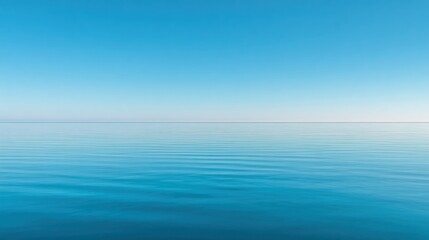 Obraz premium Wide Minimal Sky at Calm Spring Ocean Horizon With Smooth Colors Reflecting in Water and Blending Into the Background at Dusk