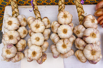 Fresh garlic bulbs on sale in French vegetable market