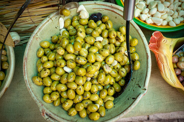 Fresh green olives for sale at an open street market