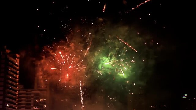 Spectacular New Years fireworks in Benidorm city Spain display over city skyline, vibrant colors burst in night sky 