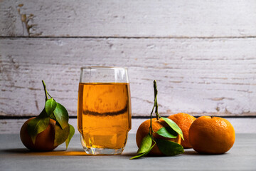 oranges fruit and juice with white wooden background