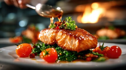 An exquisite plate of beautifully cooked salmon, topped with vibrant greens and cherry tomatoes, showcases culinary artistry and the joy of fine dining in a contemporary restaurant setting.