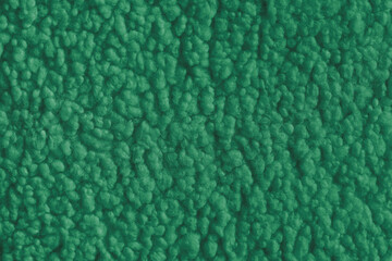 Vibrant green color fabric texture of soft faux fur cloth with fluffy surface, abstract background. Close up, macro of shaggy fabric texture, upholstery material, textile backdrop © katyamaximenko