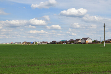 Obraz premium Suburban Housing Development and Green Field Landscape