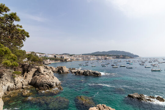 Calella de palafrugell village with boats in turquoise sea