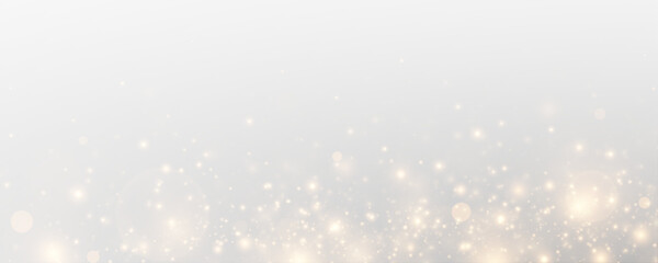 Glistering particles and sparkling effects on a transparent festive background.