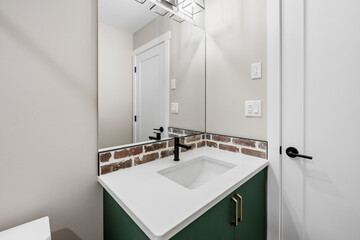 Bathroom with a white sink and a green countertop
