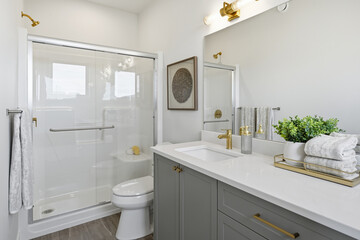 Bathroom with a white toilet and a shower stall