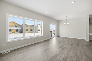 Large open living room with a window and a door