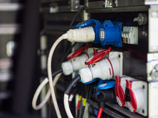Electrical panel with plugs connected in a dark room