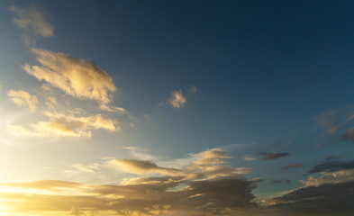 Fototapeta premium Sunset in the clouds. Sky background.