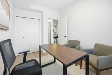 Small office with a desk and two chairs