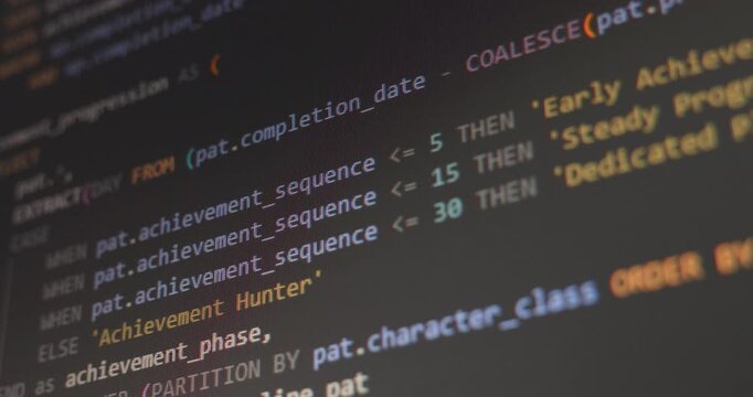 Close up video of scrolling abstract SQL game development code