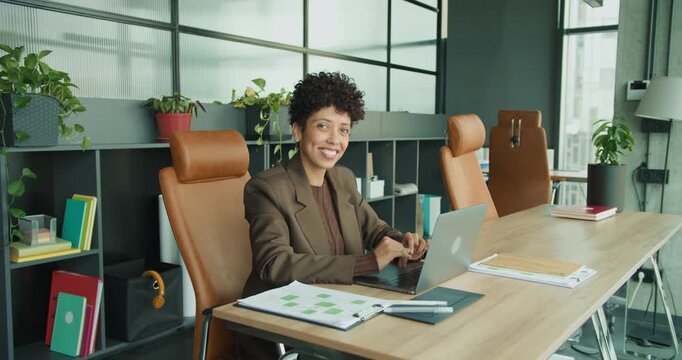 Business owner demonstrating tactics in vibrant workspace