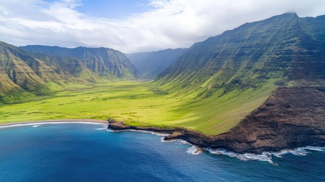 Majestic Aerial View of Lush Green Valleys Meeting Dramatic Coastal Cliffs and Azure Ocean