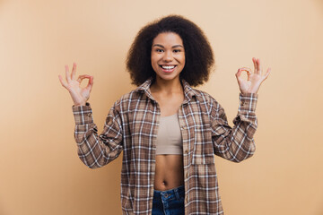 African American woman doing ok gestures smiling