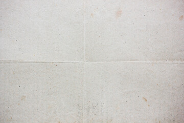 Vintage folded paper texture with visible crease lines and subtle stains, aged surface background ideal for design projects, retro layouts, scrapbook materials and creative graphic applications