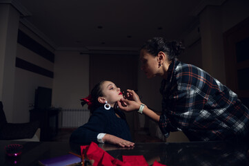 Mother Applies Lip Makeup To Daughter At Home, Bonding Through Beauty Moment