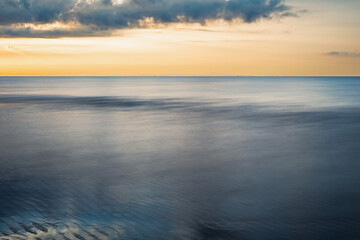 summer sunrise over the lagoon meets the sea, Bibione Pineda, Venice, Italy
