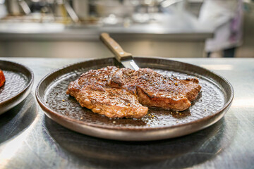 A chef at a professional restaurant kitchen prepare the ordered food before it leave to the guest room