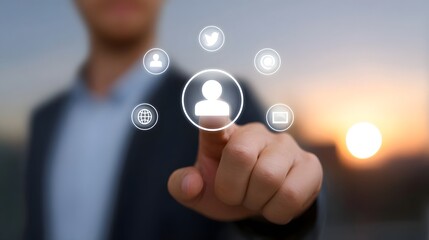 A businessman touches a digital interface with social media icons at sunset representing connection and strategy