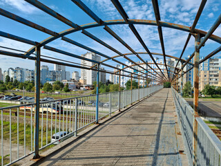 Unfinished pedestrian bridge crossing over tram lines