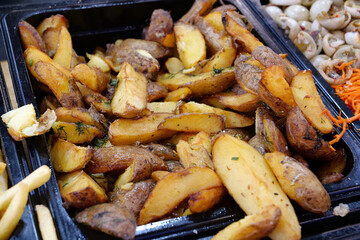 Fried yellow potatoes. Various foods in fast food restaurant