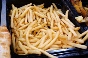 French fries. Various foods in street fast food restaurant. Fried potatoes