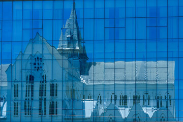 Guyana, Georgetown, the wooden St. George's Cathedral  is reflected in the windows of a neighboring building